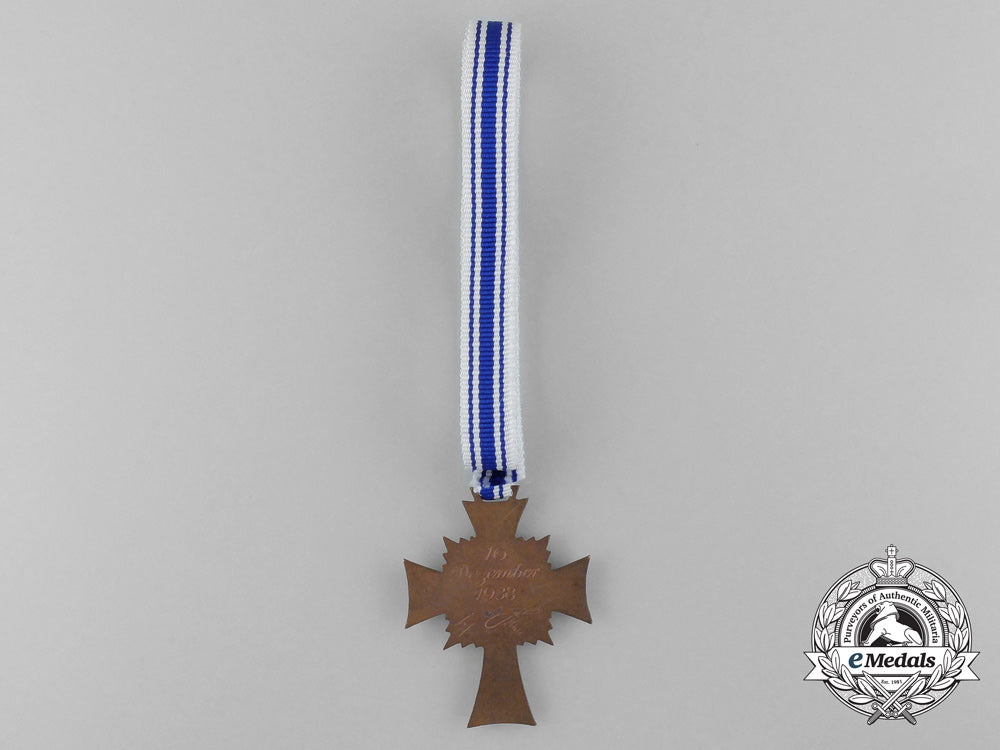 a_bronze_grade_mother’s_cross_with_original_packet_of_issue_d_0214