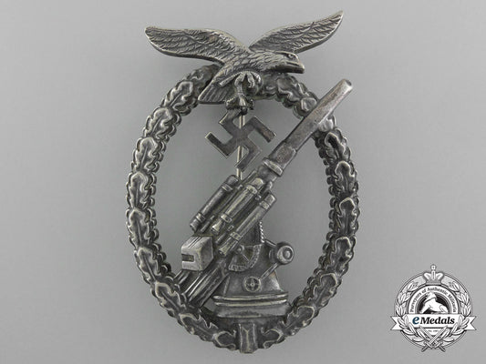 an_early_luftwaffe_flak_badge_in_tombac_with_ball_hinge_d_1285