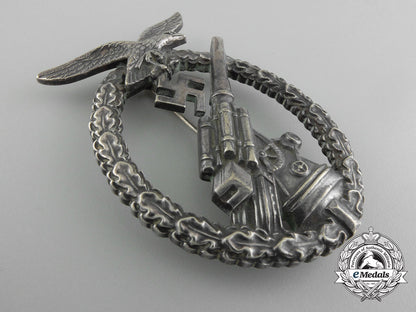 an_early_luftwaffe_flak_badge_in_tombac_with_ball_hinge_d_1287
