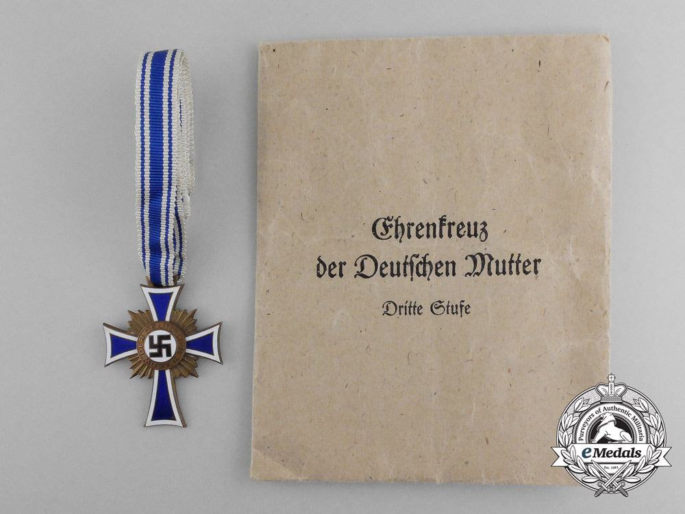 a_bronze_grade_mother’s_cross_with_original_packet_of_issue_by_karl_wurster_d_1476_1