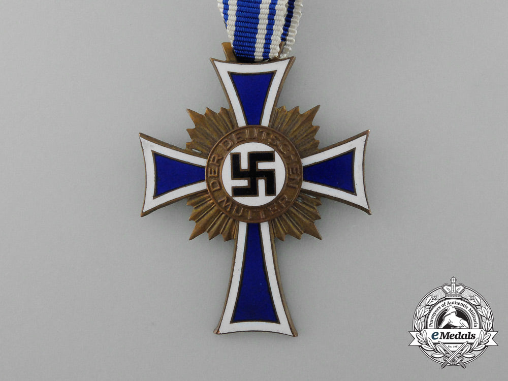 a_bronze_grade_mother’s_cross_with_original_packet_of_issue_by_karl_wurster_d_1478_1