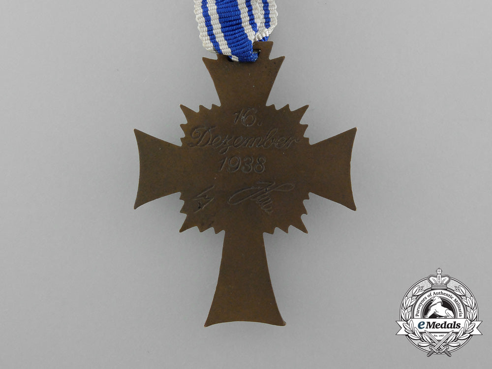 a_bronze_grade_mother’s_cross_with_original_packet_of_issue_by_karl_wurster_d_1479_1