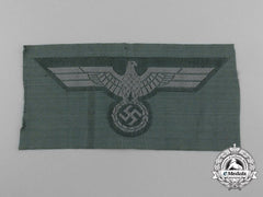 An Em/Nco’s M43 Army Trapezoid Cap Insignia