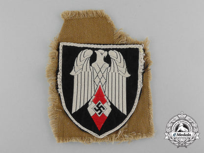 an_arm_badge_for_a_standard-_bearer_of_an_hj_gefolgschaft;_with_section_of_tunic_d_1813