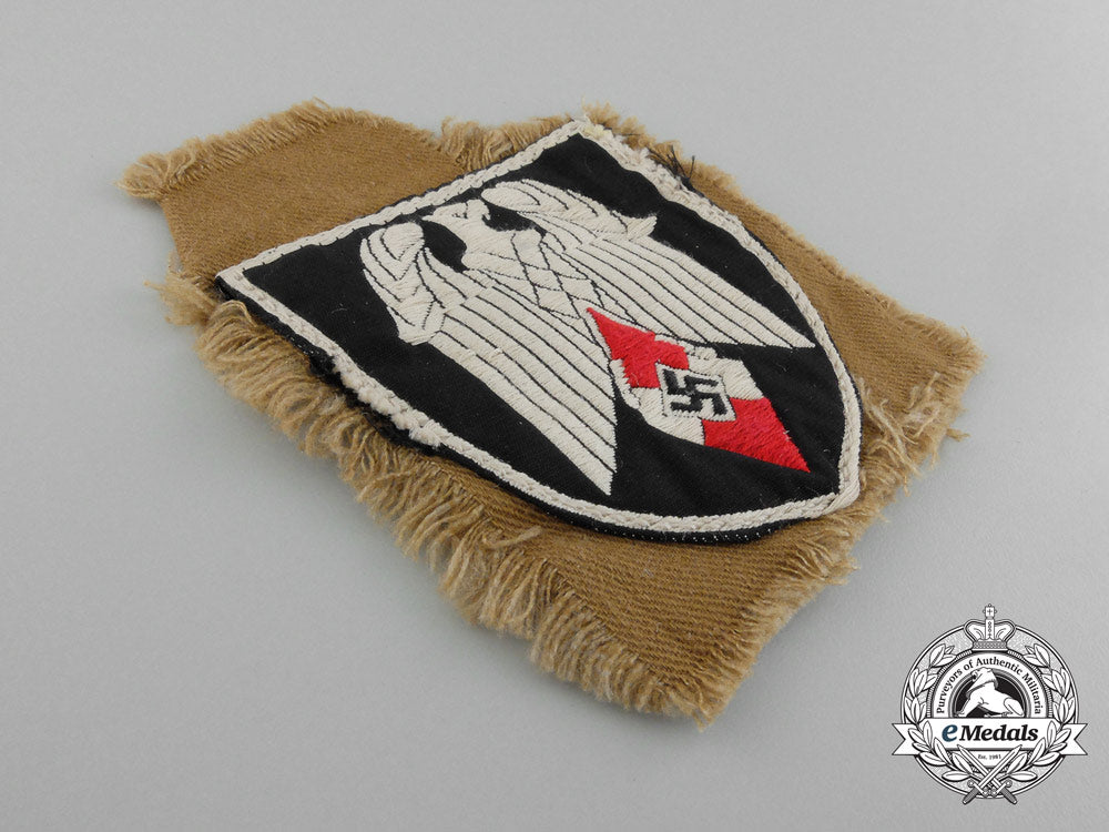 an_arm_badge_for_a_standard-_bearer_of_an_hj_gefolgschaft;_with_section_of_tunic_d_1815