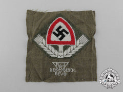 A Mint Bevo Reichsarbeitsdienst Cap Badge