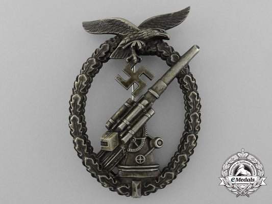 an_early_luftwaffe_flak_badge_in_tombac_with_ball_hinge_d_2857