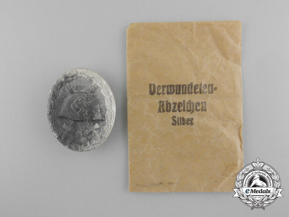 a_fine_silver_grade_wound_badge_by_carl_wild_with_original_packet_of_issue_d_3002_1