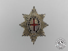 A Coldstream Guards Officer`s Sterling Silver Cap Badge