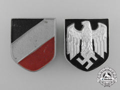A Set Of German Tropical Pith Helmet Insignia