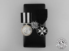 An Order Of St. John Award Pairing In Case