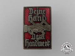 A Fine Quality National Socialist Hago “Deine Hand Dem Handwerk” Badge; Marked