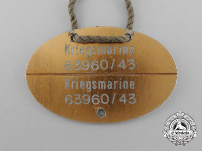 a_scarce_kriegsmarine_identification_tag_on_original_string_necklace_d_4416_1
