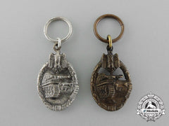 A Set Of Bronze And Silver Grade Miniature Tank Badges