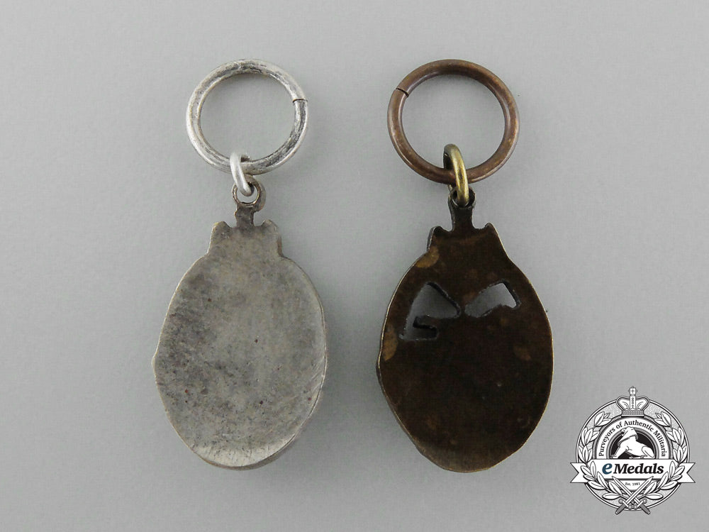 a_set_of_bronze_and_silver_grade_miniature_tank_badges_d_4789_1