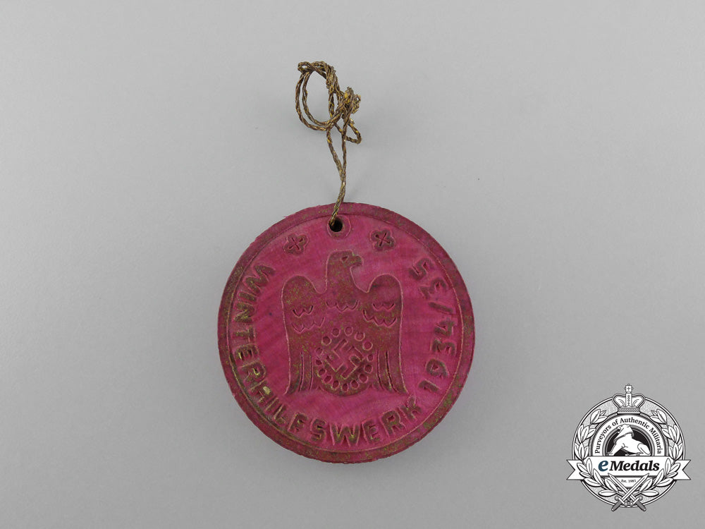 a1934/35_winterhilfswerk_badge;_marked_d_5350
