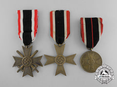 A Group Of Three War Merit Medals And Crosses