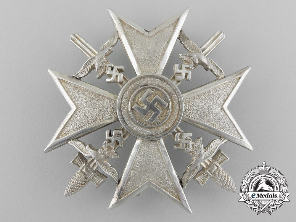 a_fine_quality_spanish_cross_with_swords_in_silver_by_c._e._juncker_in_its_original_case_of_issue_d_7600_1