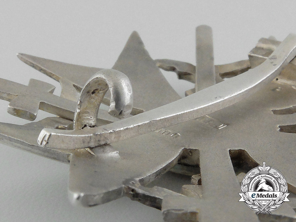 a_fine_quality_spanish_cross_with_swords_in_silver_by_c._e._juncker_in_its_original_case_of_issue_d_7604_1