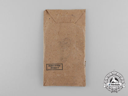 an_absolutely_mint_war_merit_cross_without_swords_in_its_original_packet_of_issue_by_deschler&_sohn_d_7620_1