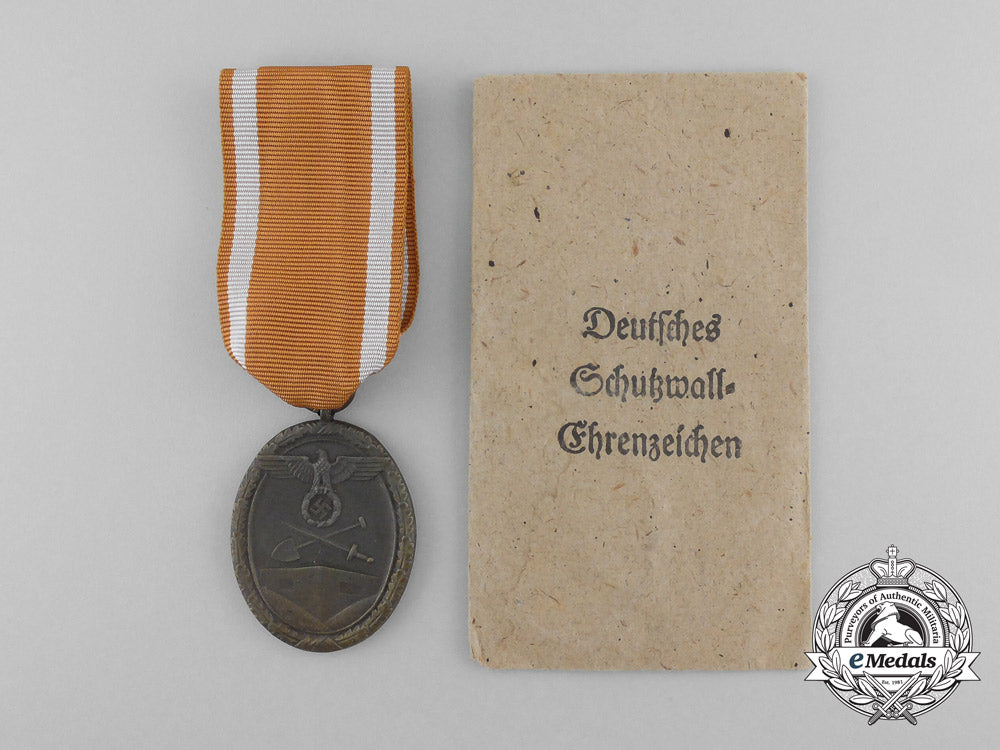 a_second_war_west_wall_medal_with_packet_of_issue_by_carl_poellath_of_schrobenhausen_d_7635