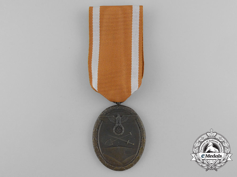 a_second_war_west_wall_medal_with_packet_of_issue_by_carl_poellath_of_schrobenhausen_d_7636