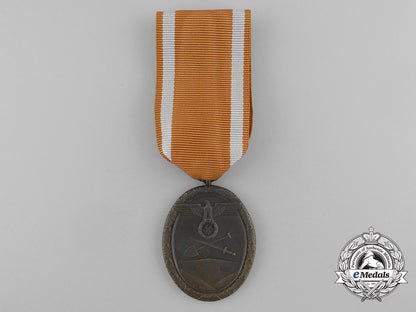 a_second_war_west_wall_medal_with_packet_of_issue_by_carl_poellath_of_schrobenhausen_d_7636