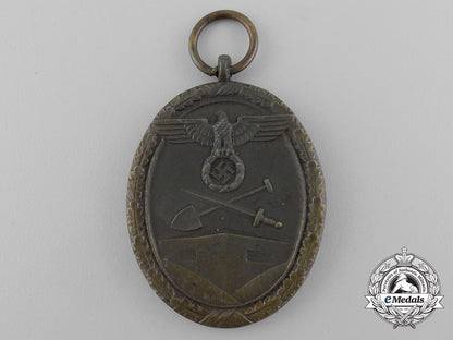 a_second_war_west_wall_medal_with_packet_of_issue_by_carl_poellath_of_schrobenhausen_d_7637