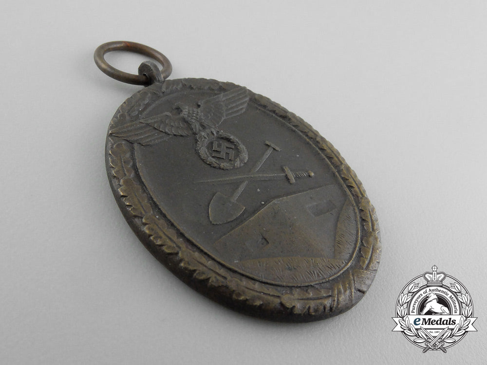 a_second_war_west_wall_medal_with_packet_of_issue_by_carl_poellath_of_schrobenhausen_d_7640_1