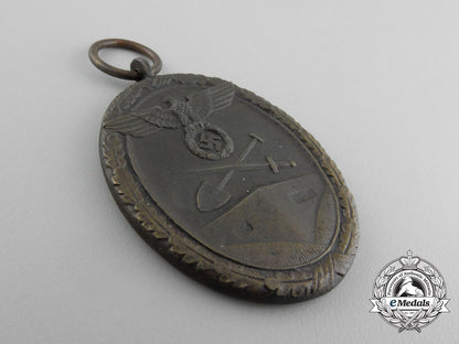a_second_war_west_wall_medal_with_packet_of_issue_by_carl_poellath_of_schrobenhausen_d_7640_1