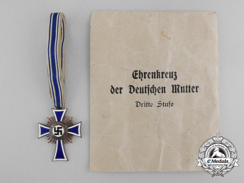 a_bronze_grade_mother’s_cross_with_original_packet_of_issue_by_wilhelm_schröder&_co._d_7839