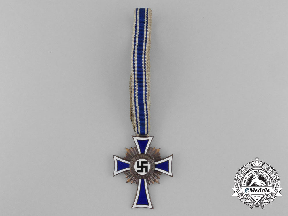 a_bronze_grade_mother’s_cross_with_original_packet_of_issue_by_wilhelm_schröder&_co._d_7840