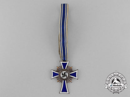 a_bronze_grade_mother’s_cross_with_original_packet_of_issue_by_wilhelm_schröder&_co._d_7840