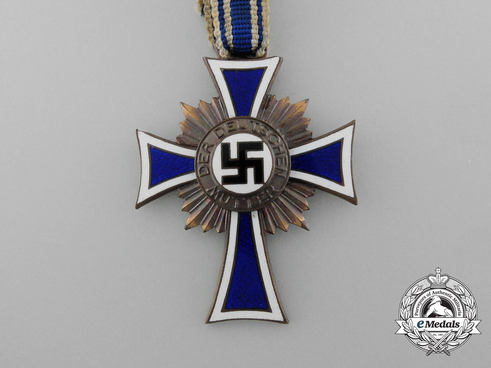 a_bronze_grade_mother’s_cross_with_original_packet_of_issue_by_wilhelm_schröder&_co._d_7841