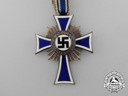 a_bronze_grade_mother’s_cross_with_original_packet_of_issue_by_wilhelm_schröder&_co._d_7841