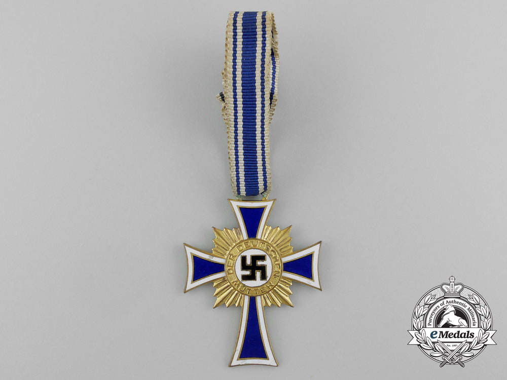 a_golden_grade_german_mother’s_cross_with_its_original_case_of_issue_by_werner_redd_d_7864_1