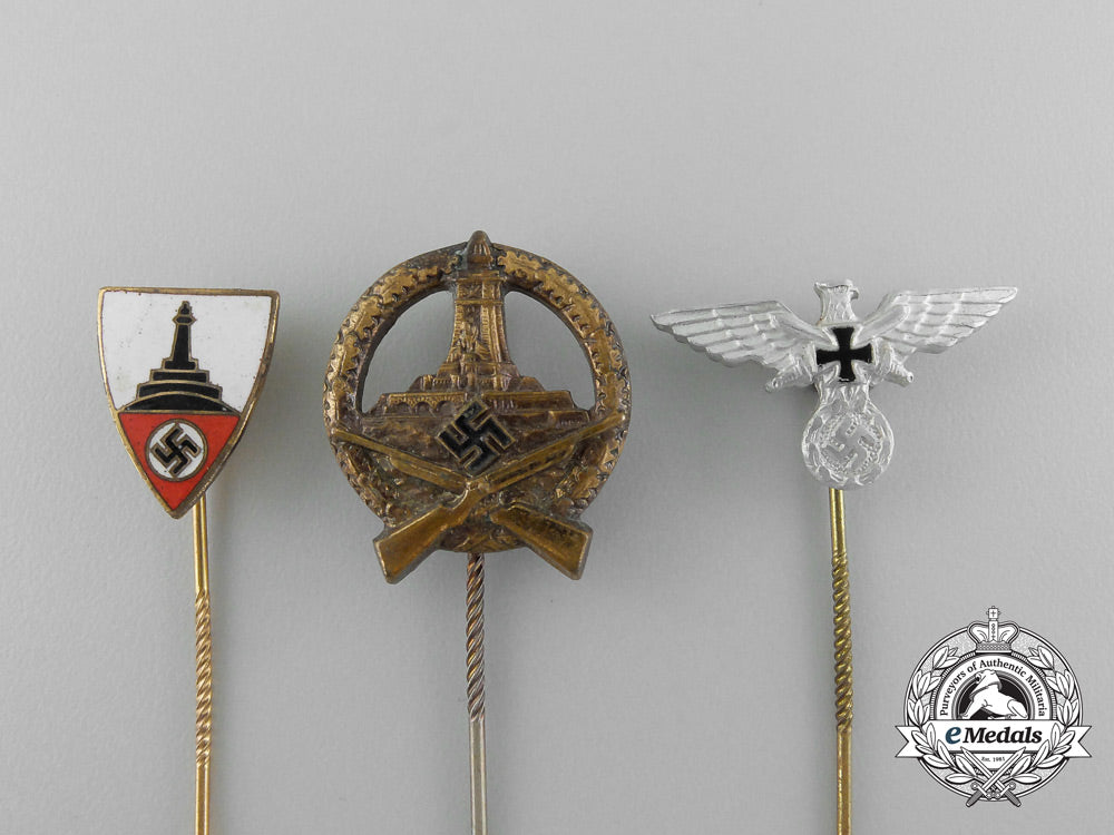 a_grouping_of_three_third_reich_period_veteran’s_organization_stick_pins_d_7884_1