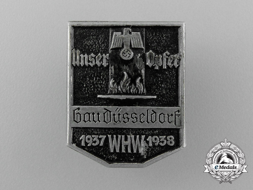 a1937/38_whw(_winter_relief_of_the_german_people)_gau_düsseldorf_donation_badge_d_8313_1