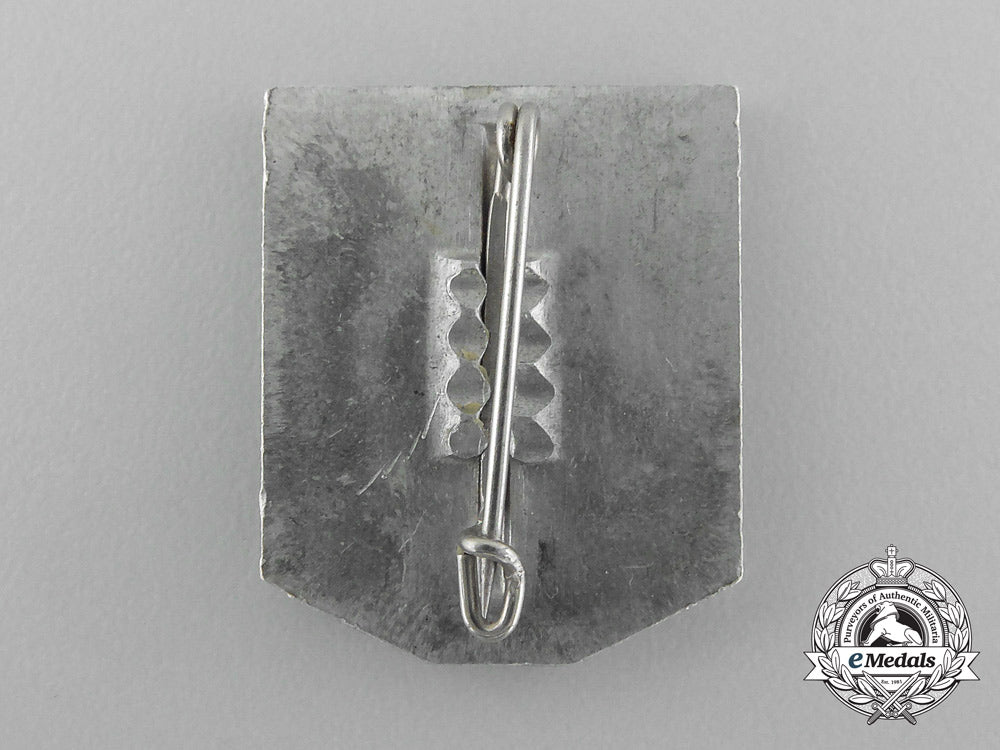 a1937/38_whw(_winter_relief_of_the_german_people)_gau_düsseldorf_donation_badge_d_8314_1