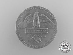 A Fine Quality 1939 Reichsnährstand/Blood And Soil Leipzig Exhibition Badge By Otto Fechler