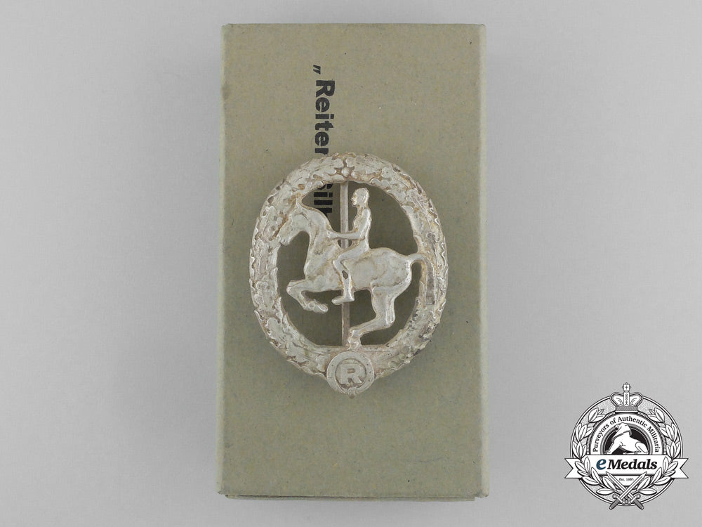 germany,_third_reich._a_silver_grade_horseman's_badge_by_steinhauer&_lück_in_its_original_case_of_issue_d_8916_1