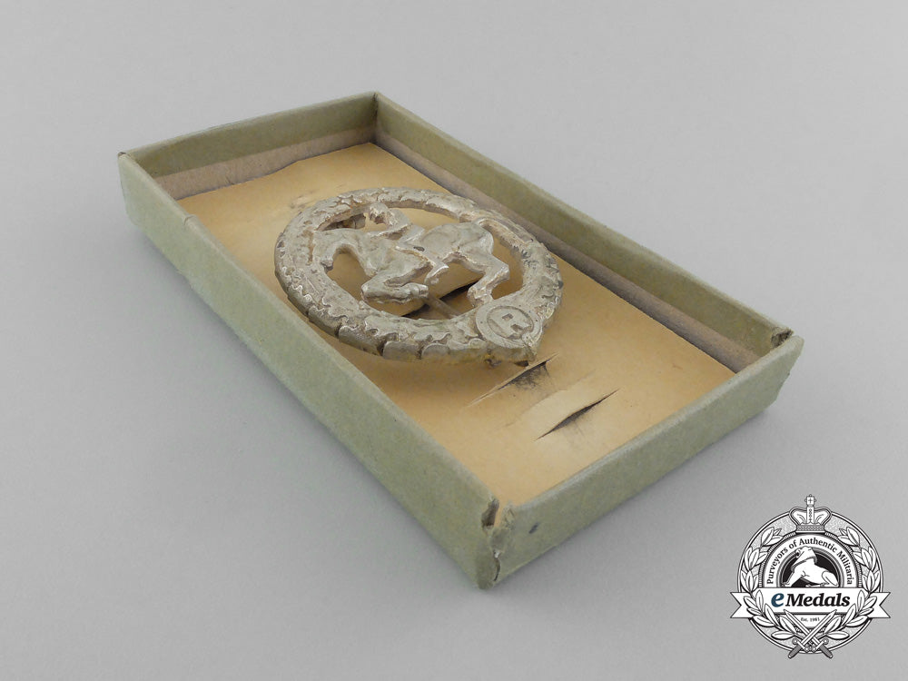 germany,_third_reich._a_silver_grade_horseman's_badge_by_steinhauer&_lück_in_its_original_case_of_issue_d_8918_1