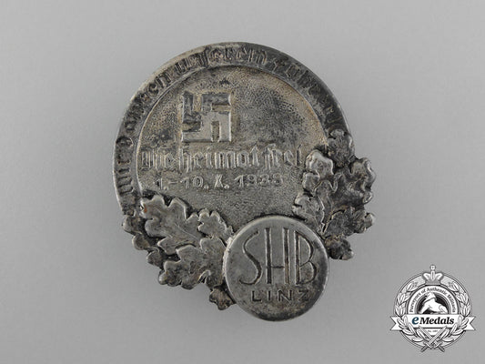 germany,_nsdap._a1938_linz“_we_thank_our_führer-_our_homeland_is_free”_badge_d_8977_1