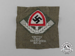 A Mint Bevo Reichsarbeitsdienst Cap Badge