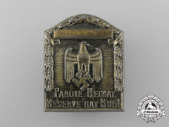 A Third Reich Period “Our Motto Is Homeland” Badge
