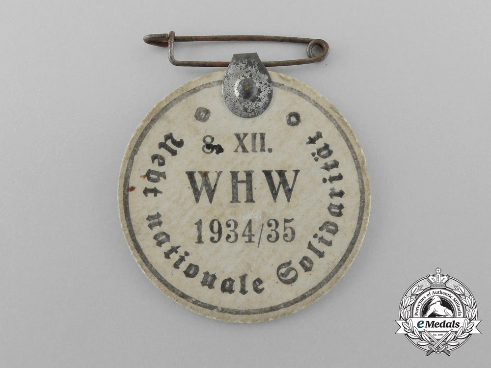 a1934/35_winter_aid_of_the_german_people“_bring_national_solidarity”_badge_d_9420