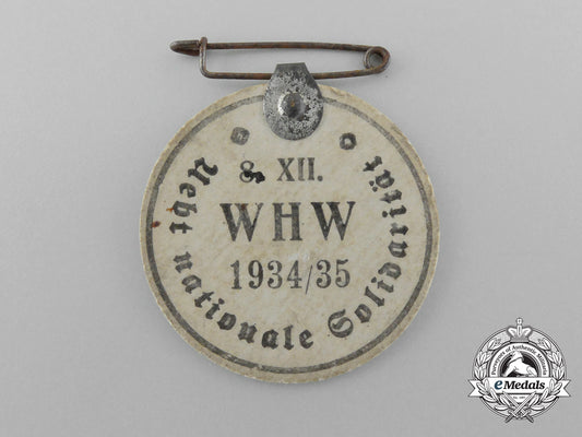 a1934/35_winter_aid_of_the_german_people“_bring_national_solidarity”_badge_d_9420