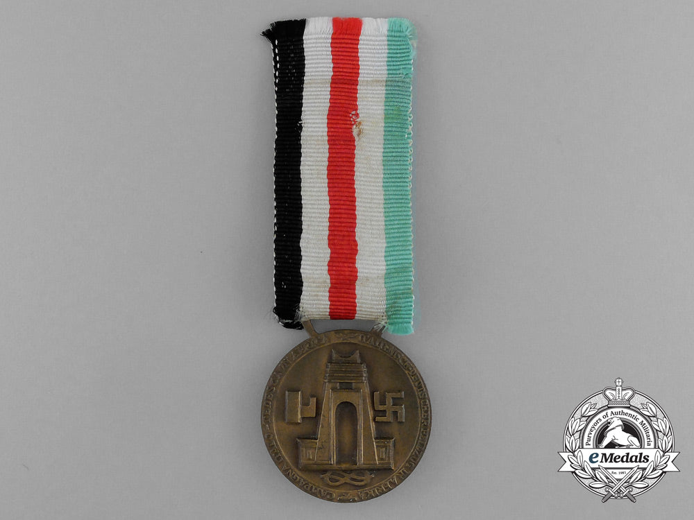 a_german-_italian_africa_campaign_medal_with_its_original_packet_of_issue_by_lorioli_fratelli_d_9452_1