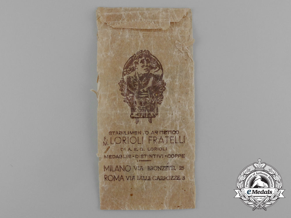 a_german-_italian_africa_campaign_medal_with_its_original_packet_of_issue_by_lorioli_fratelli_d_9454_1