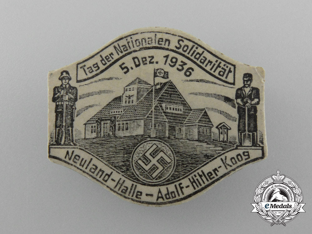 germany,_third_reich._a1936_neuland“_day_of_national_solidarity”_badge_d_9876